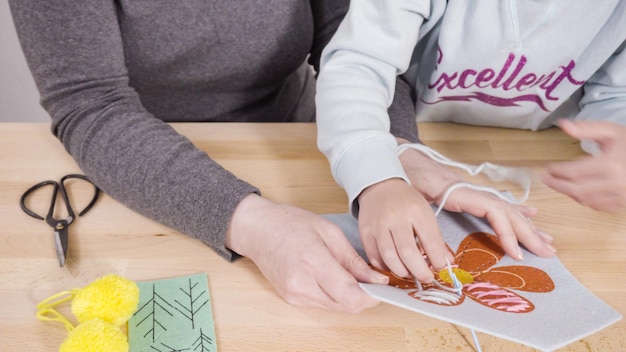 Instructor demonstrating embroidery
